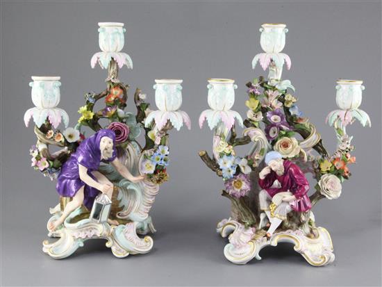 A pair Meissen figural three branch candelabra, late 19th century, 30.5cm and 31cm, tiny losses to flowers